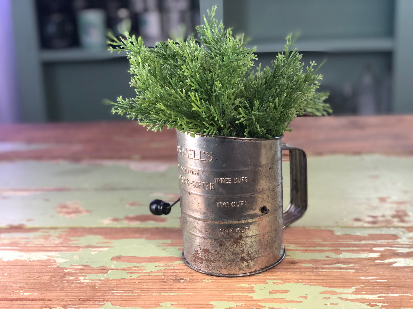 Vintage Black Handled Sifter with Greenery